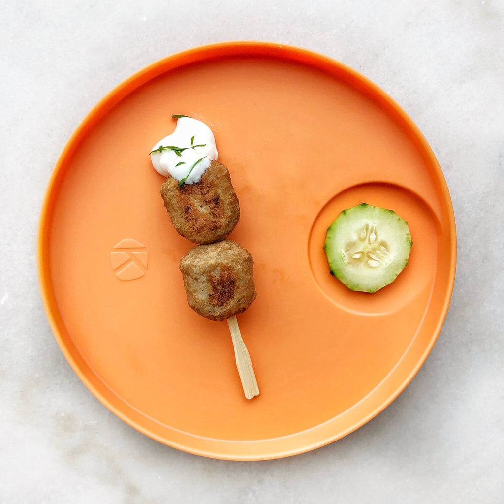 Kizingo baby and toddler nudge plate helps practice tasting foods